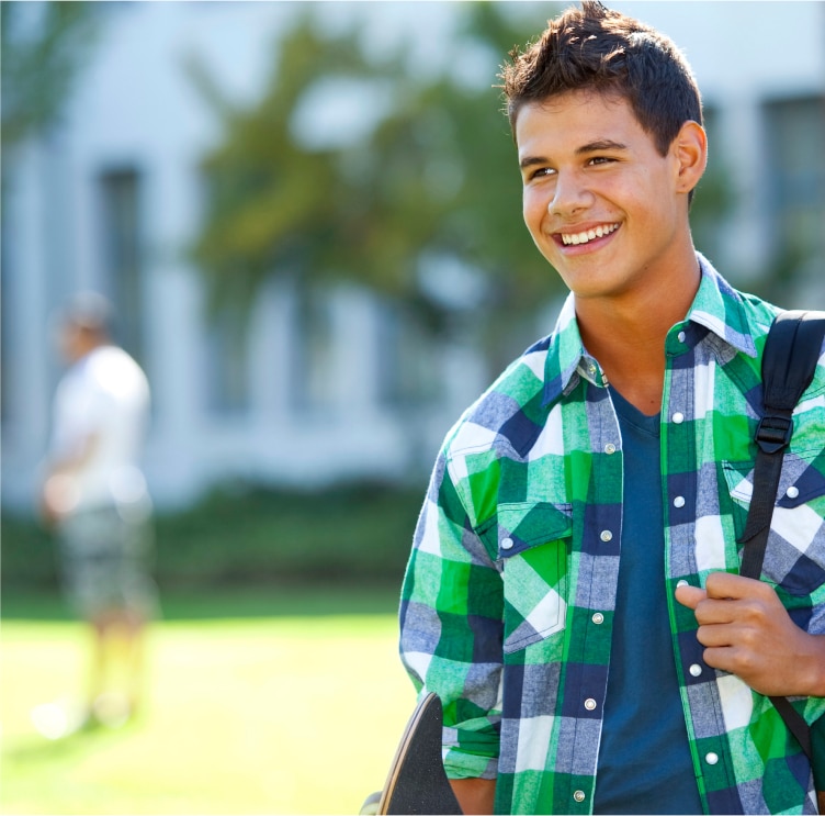 A young college student with a backpack