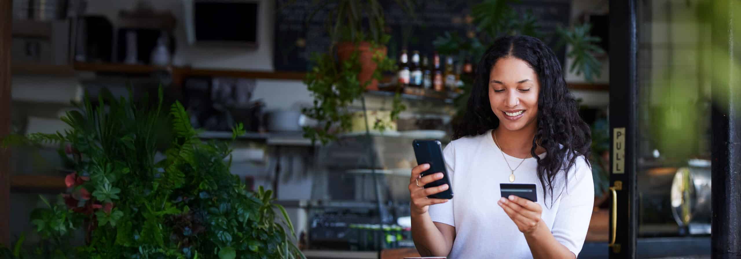 a woman holding a phone