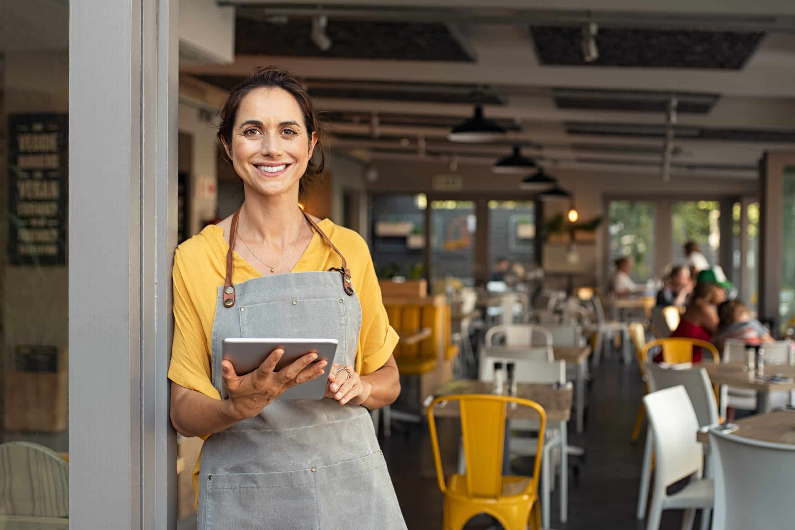 a woman holding a tablet